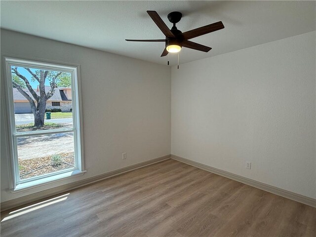 2413 Still Brook Dr, Corpus Christi, TX 78414 - empty room featuring baseboards, a ceiling fan, and light wood-style floors
