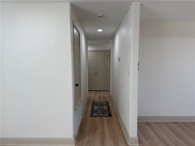 2413 Still Brook Dr, Corpus Christi, TX 78414 - hallway featuring baseboards and wood finished floors