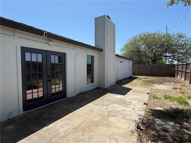 2413 Still Brook Dr, Corpus Christi, TX 78414 - back of property featuring a patio area, brick siding, french doors, and fence private yard