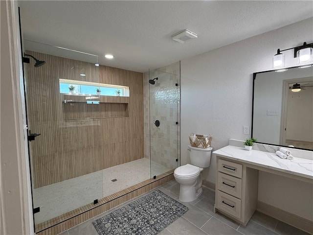 2413 Still Brook Dr, Corpus Christi, TX 78414 - bathroom with vanity, baseboards, tile patterned floors, toilet, and a tile shower