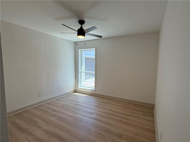 2413 Still Brook Dr, Corpus Christi, TX 78414 - spare room with a textured wall, baseboards, ceiling fan, and wood finished floors