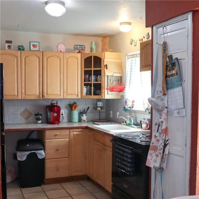4625 Mildred Dr, Corpus Christi, TX 78411 - kitchen featuring light countertops, black electric range, light brown cabinets, and a sink