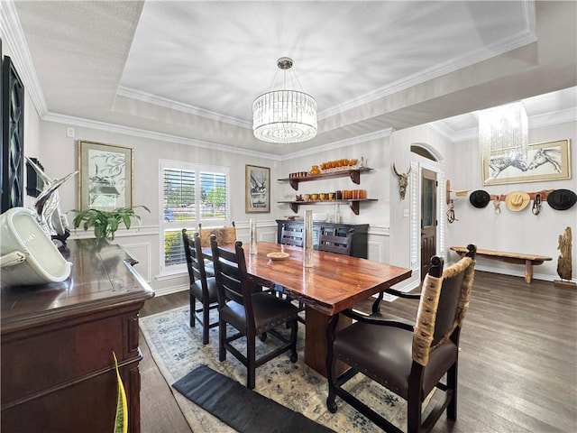 13910 Riverway Dr, Corpus Christi, TX 78410 - dining space with a chandelier, dark wood-style floors, ornamental molding, and a tray ceiling