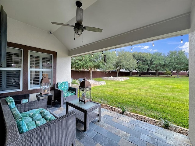 13910 Riverway Dr, Corpus Christi, TX 78410 - fenced backyard featuring a patio, outdoor lounge area, and a ceiling fan