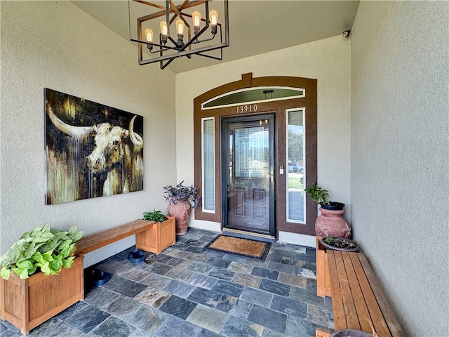 13910 Riverway Dr, Corpus Christi, TX 78410 - doorway to property featuring stucco siding and a surveillance system