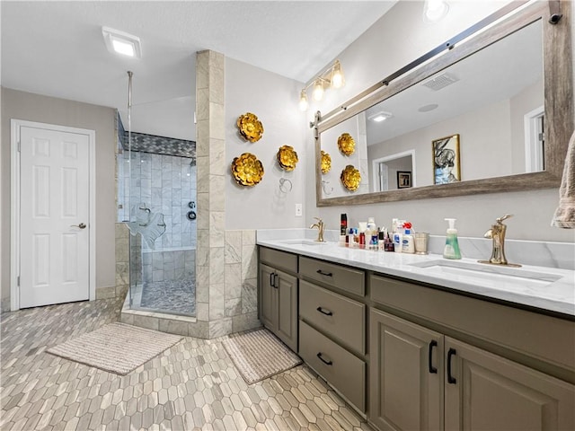 13910 Riverway Dr, Corpus Christi, TX 78410 - bathroom with double vanity, a stall shower, and tile patterned floors