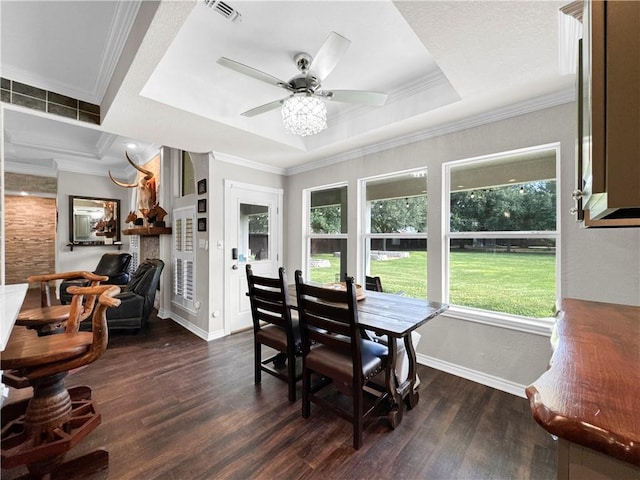 13910 Riverway Dr, Corpus Christi, TX 78410 - dining space featuring healthy amount of natural light, dark wood-type flooring, ornamental molding, and a ceiling fan