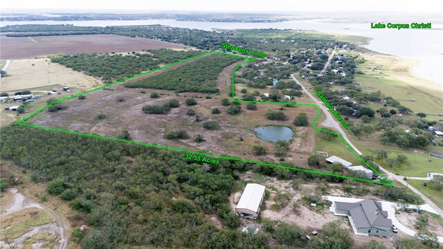 bird's eye view with a water view and a rural view