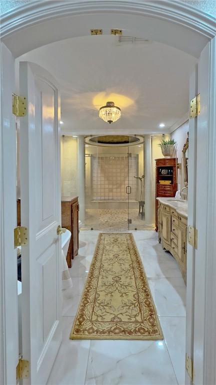11157 Jackson Ter, Corpus Christi, TX 78410 - corridor featuring light marble finish floors and arched walkways