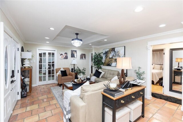 11157 Jackson Ter, Corpus Christi, TX 78410 - living room featuring a raised ceiling, recessed lighting, crown molding, and a chandelier
