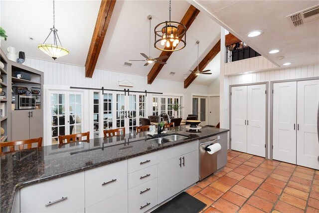 11157 Jackson Ter, Corpus Christi, TX 78410 - kitchen with a ceiling fan, decorative light fixtures, white cabinets, stainless steel dishwasher, and open floor plan