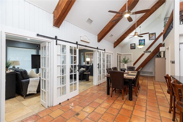 11157 Jackson Ter, Corpus Christi, TX 78410 - dining room with a barn door, high vaulted ceiling, beam ceiling, ceiling fan, and stairway