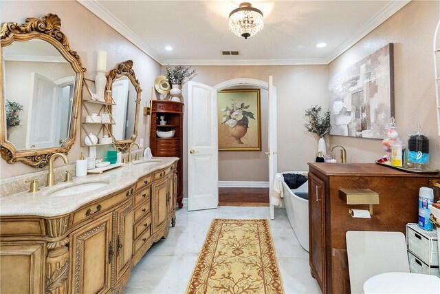 11157 Jackson Ter, Corpus Christi, TX 78410 - bathroom with double vanity, a bathtub, crown molding, and recessed lighting