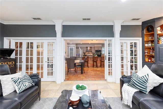 11157 Jackson Ter, Corpus Christi, TX 78410 - living room with french doors, crown molding, and decorative columns