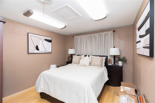 11157 Jackson Ter, Corpus Christi, TX 78410 - bedroom with light wood-style floors and attic access