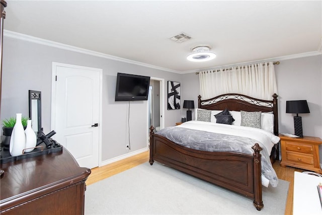 11157 Jackson Ter, Corpus Christi, TX 78410 - bedroom with crown molding and light wood-style flooring