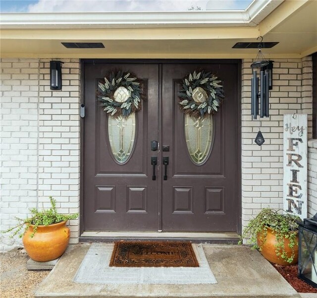 11157 Jackson Ter, Corpus Christi, TX 78410 - view of exterior entry with brick siding and a porch