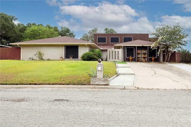 11157 Jackson Ter, Corpus Christi, TX 78410 - view of front of house featuring driveway and brick siding