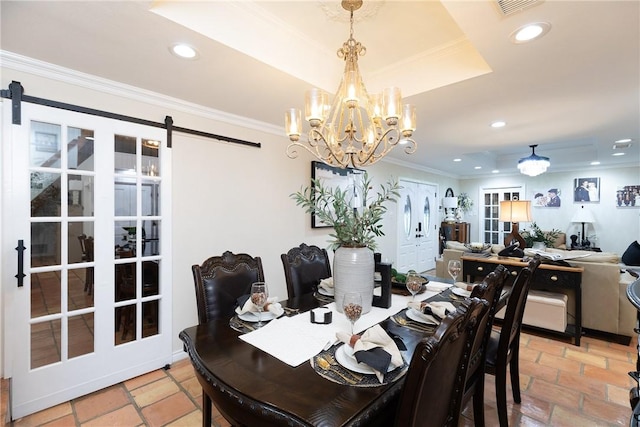 11157 Jackson Ter, Corpus Christi, TX 78410 - dining area with a raised ceiling, recessed lighting, ornamental molding, a barn door, and a chandelier