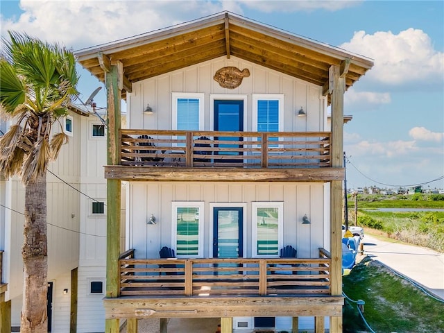 1002 State Highway 361, Port Aransas, TX 78373 - view of front of house featuring a balcony and board and batten siding