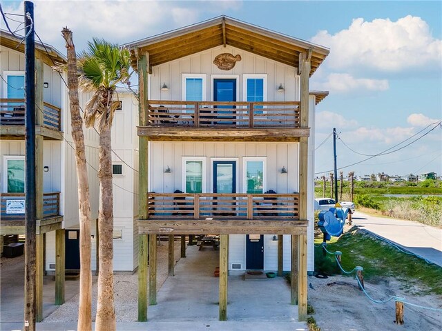 1002 State Highway 361, Port Aransas, TX 78373 - view of front facade with a balcony and a carport