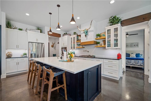 340 Warbler Dr, Spring Branch, TX 78070 - kitchen featuring tasteful backsplash, white cabinets, recessed lighting, and concrete flooring