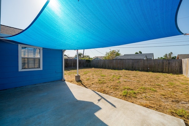 view of yard with a fenced backyard and a patio