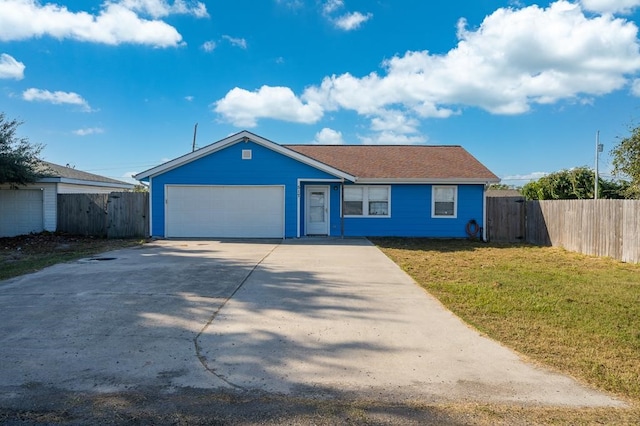 ranch-style house featuring a garage, fence, driveway, and a front lawn