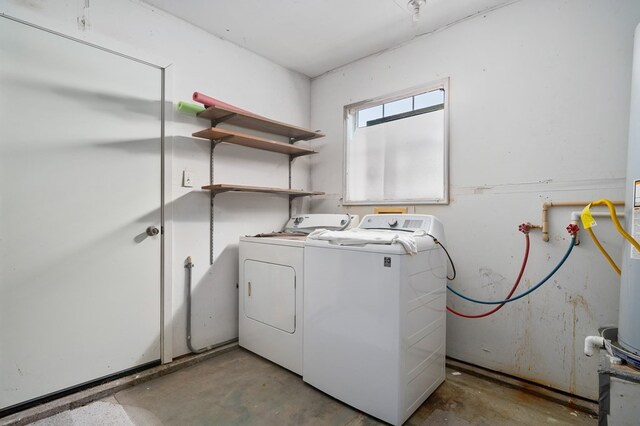 laundry area with laundry area and washer and clothes dryer