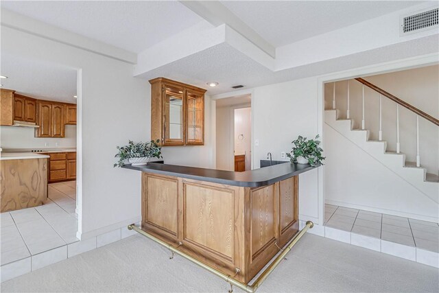 13714 A La Entrada St, Corpus Christi, TX 78418 - bar with light tile patterned floors, recessed lighting, stairs, and under cabinet range hood