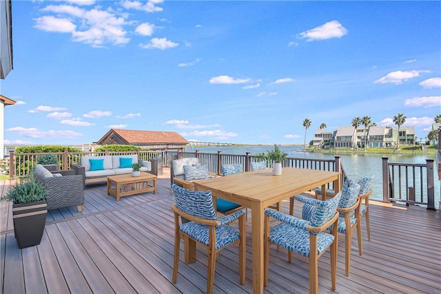 wooden deck featuring outdoor lounge area and a water view