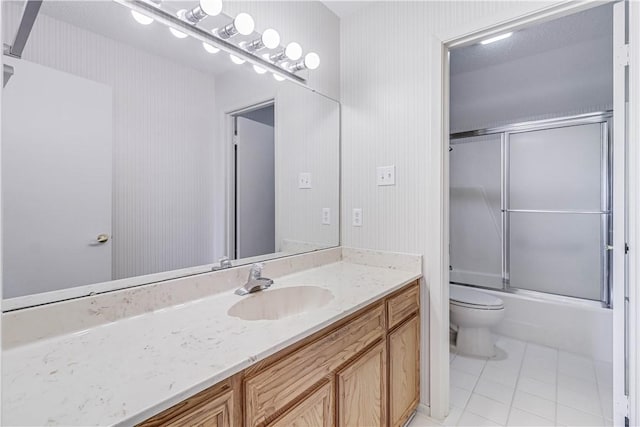 13714 A La Entrada St, Corpus Christi, TX 78418 - bathroom featuring tile patterned flooring, toilet, vanity, and enclosed tub / shower combo