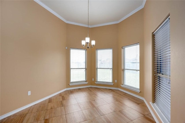 spare room featuring a notable chandelier, baseboards, and crown molding