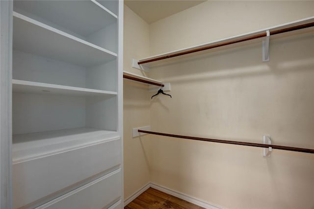 spacious closet with wood finished floors