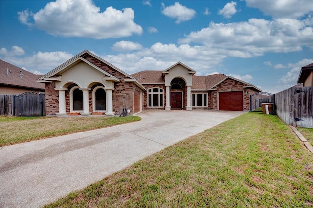 ranch-style home with an attached garage, brick siding, fence, concrete driveway, and a front lawn