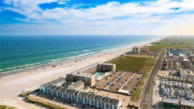 drone / aerial view with a beach view and a water view