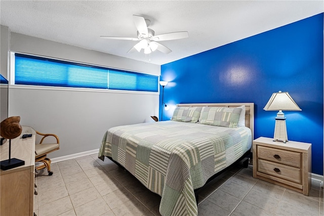 tiled bedroom featuring ceiling fan