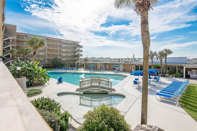 view of swimming pool featuring a patio area