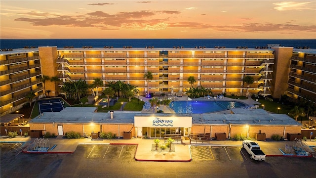 aerial view at dusk with a water view