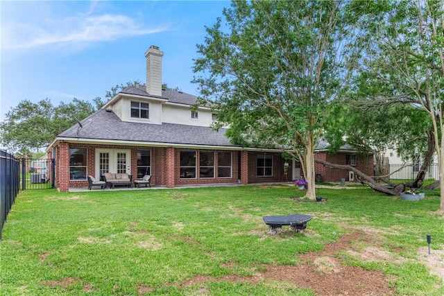 7617 Dijon Lake Dr, Corpus Christi, TX 78413 - rear view of house with outdoor lounge area, a chimney, brick siding, and roof with shingles