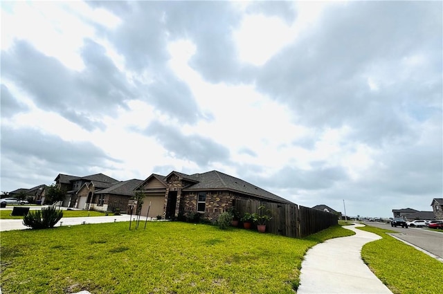 1353 Regents Park Ln, Corpus Christi, TX 78415 - view of front of property with stone siding and a residential view