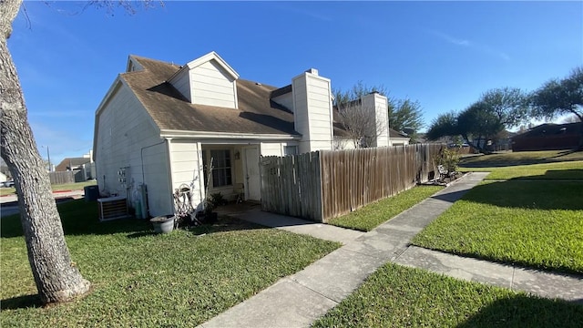 view of home's exterior featuring a yard