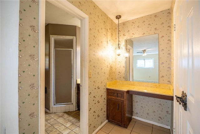 bathroom featuring vanity, tile patterned flooring, and a shower with door