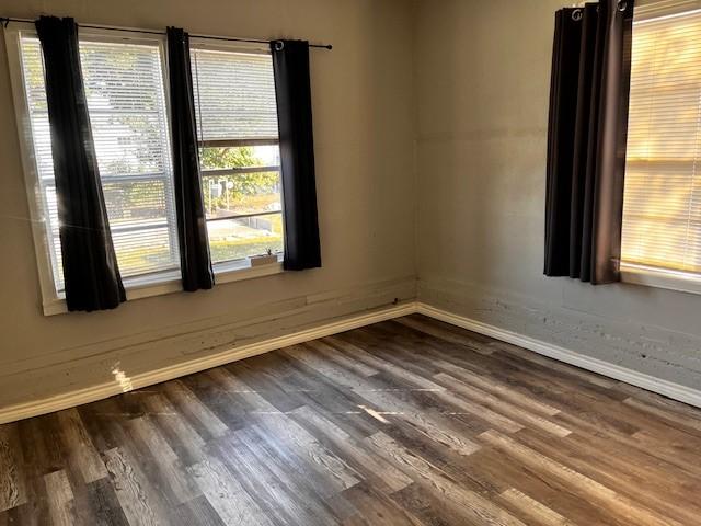 spare room featuring hardwood / wood-style floors