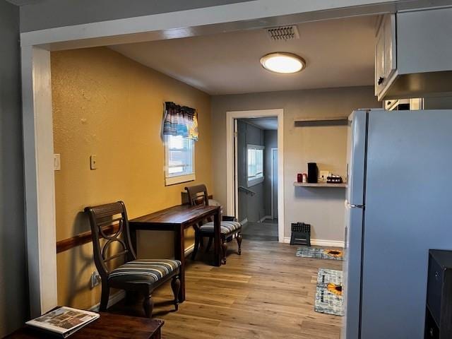 dining area with light wood-type flooring