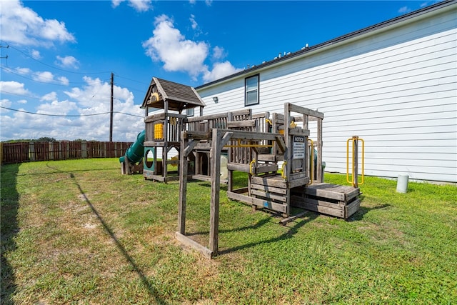 view of jungle gym featuring a lawn