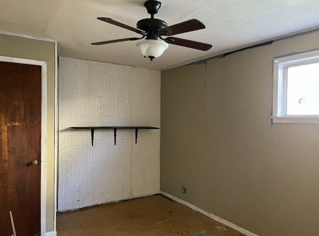 spare room with ceiling fan