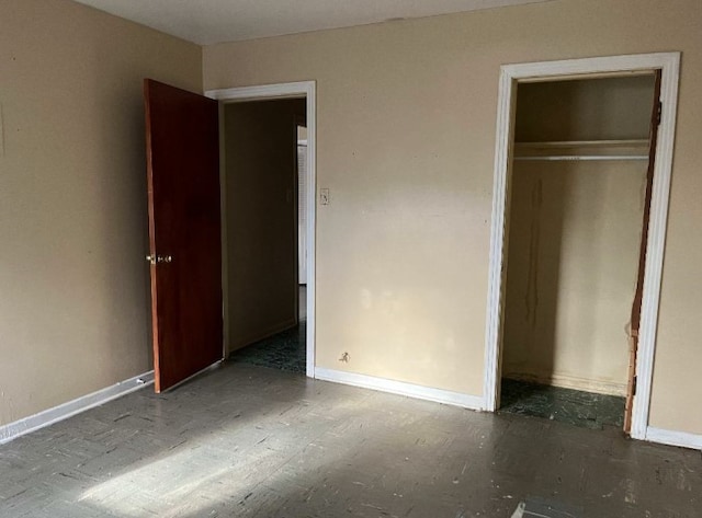 unfurnished bedroom with a closet