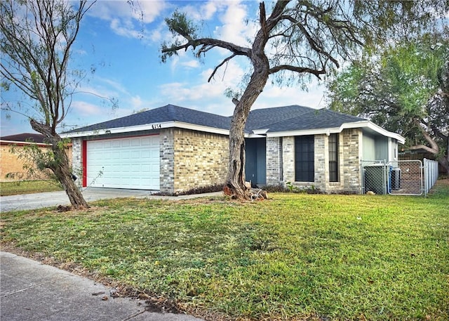 single story home with a front yard and a garage