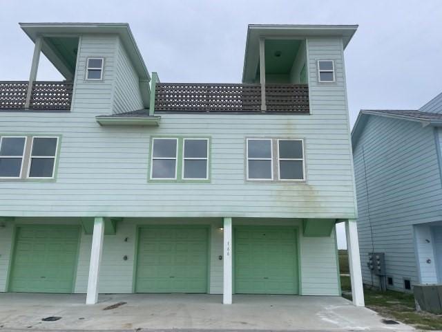 view of front of home featuring an attached garage and concrete driveway